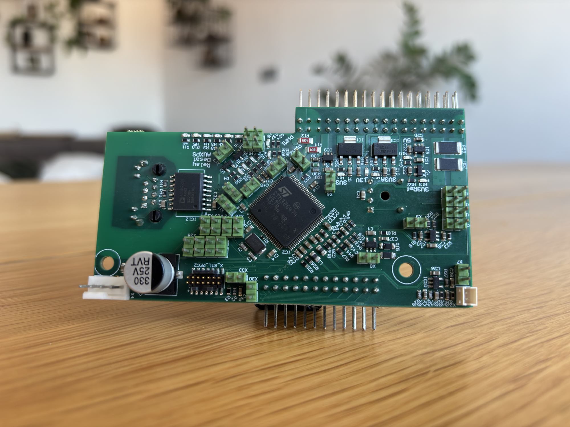 Synchronous motor control card with an STM32 microcontroller, gate-driver circuitry, and header pins for a robotic arm actuator